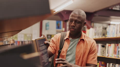 a student reading a book in the library