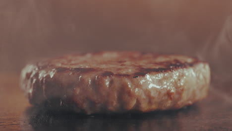 close-up of a cooking hamburger patty