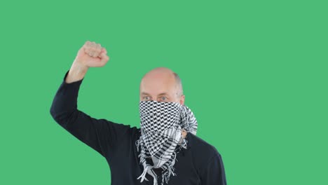 protester man in checkered bandana at demonstration on green chroma key background. bald man with fist hand chanting on social revolution. people riots and uprisings.