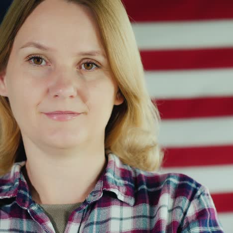 portrait of a young woman in the background of the us flag