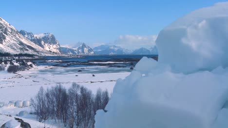 Traveling-reveal-from-an-iceberg-to-gorgeous-wintertime-fjords-north-of-the-Arctic-Circle-in-Lofoten-Islands-Norway