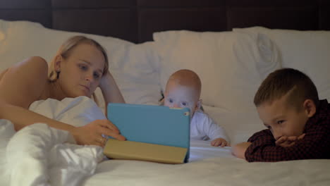 a mother and her kids having family time before bed