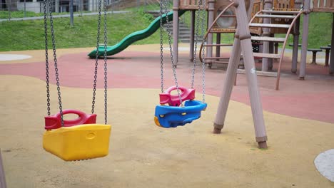 empty playground with colorful swings