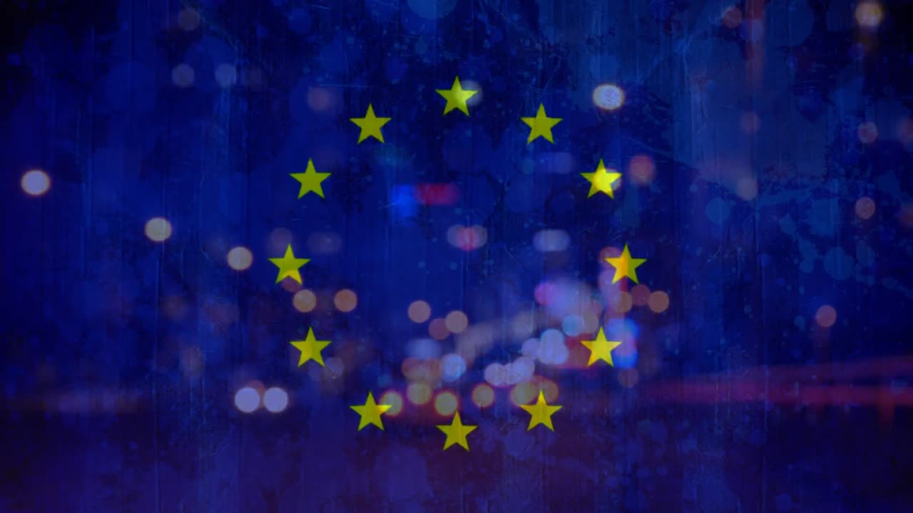 European flag and cars in the city by night