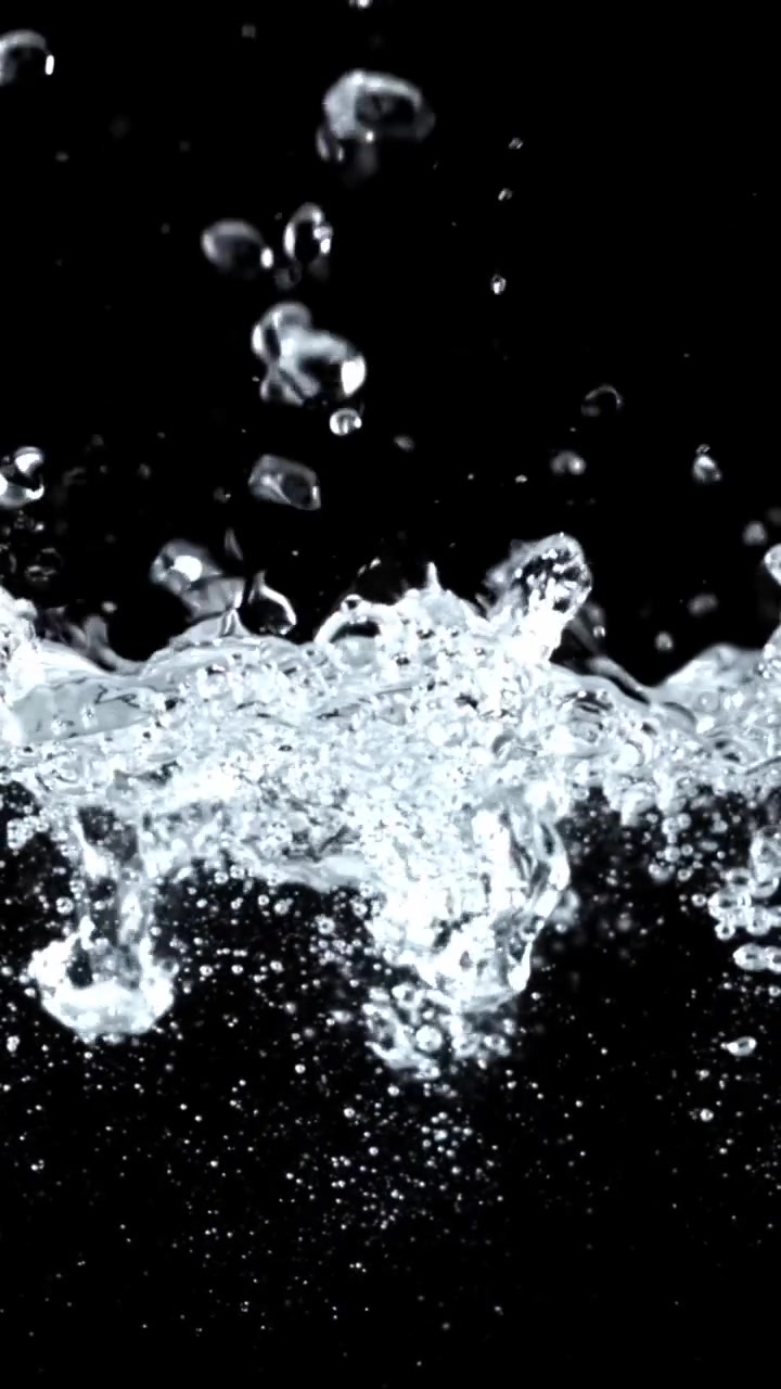 Dynamic Clear Water Splashing and Bubbling Against Black Background