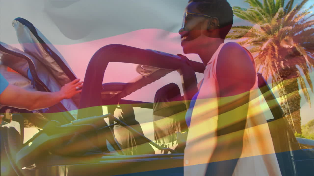 Holding German flag, people attending outdoor event with animation and festivities