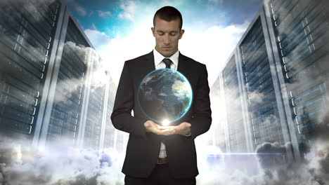 businessman holding digital generated globe