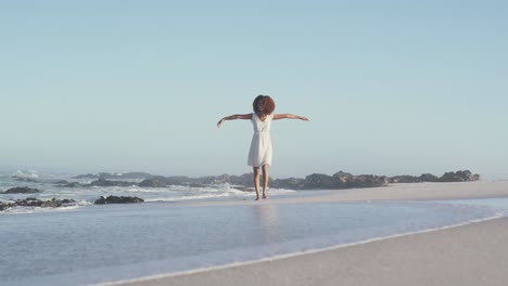 african american woman walking seaside