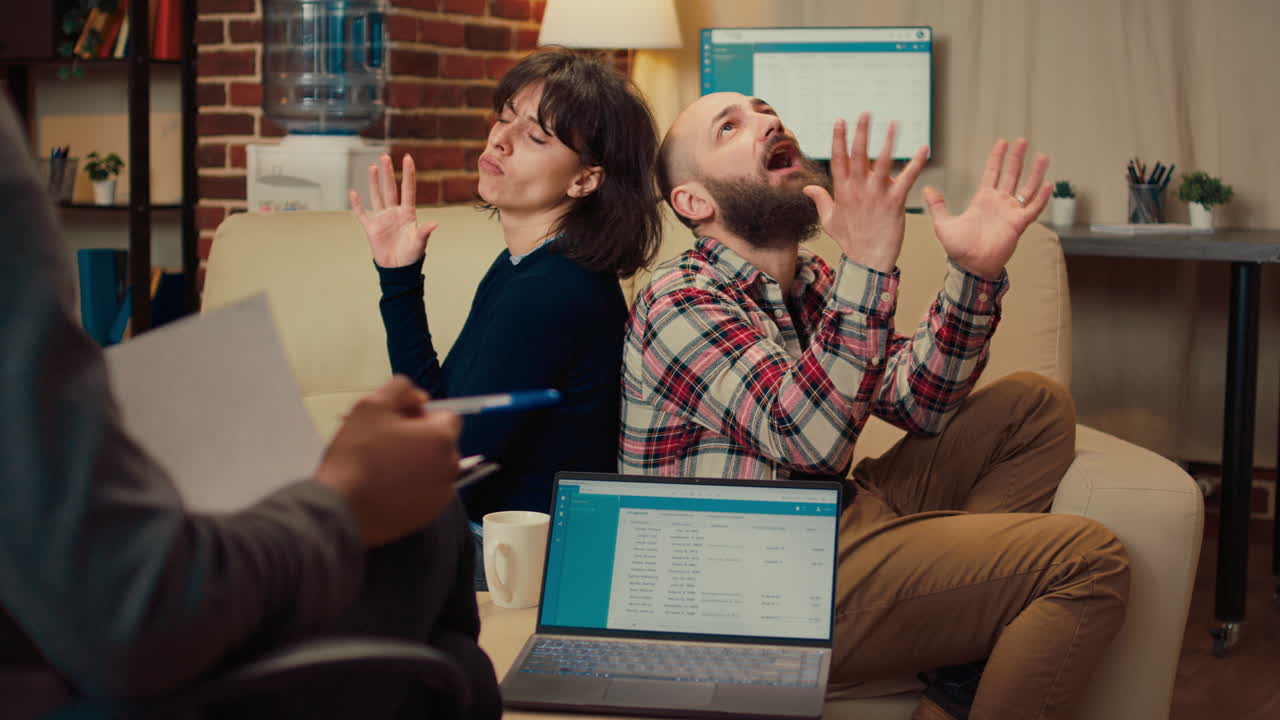 Displeased people attending therapy session with marriage counselor