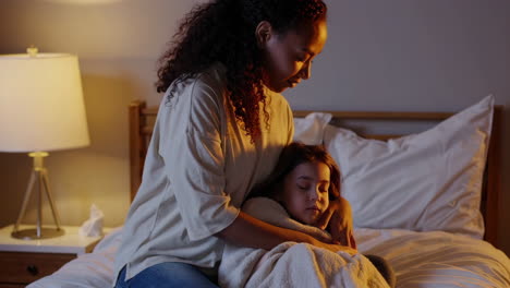 mother comforting her child in bed