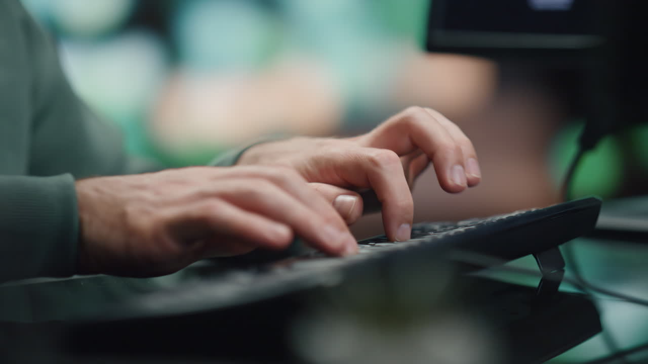 Programer hands typing keyboard working computer in data center room closeup