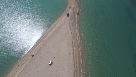 4k-tilt-up-clip-over-a-peninsula-on-the-tropical-beach-of-Epanomi,-Halkidiki,-Greece