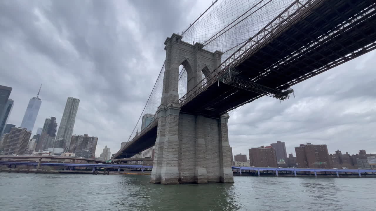Passing Under a New York City Bride by Ferry and arriving downtown NYC - High frame rate