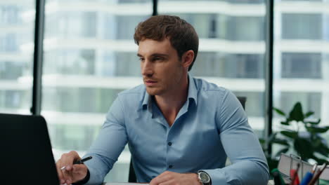 portrait responsible office manager working in company skyscraper sitting office