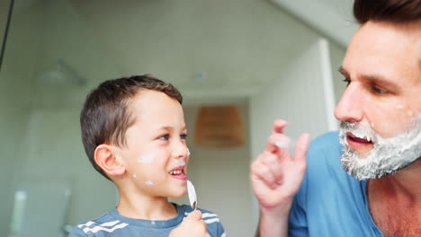 laughing, shaving and a father teaching his son