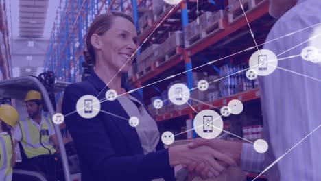 Animation-of-network-of-connections-with-icons-over-man-and-woman-working-in-warehouse