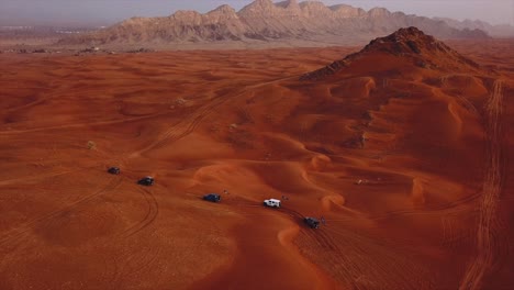 Traveling-through-the-red-sand-mountains-of-Dubai--aerial