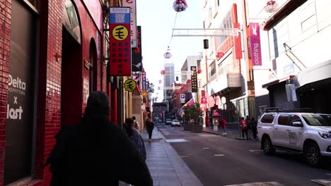 people walking in melbourne's chinatown street