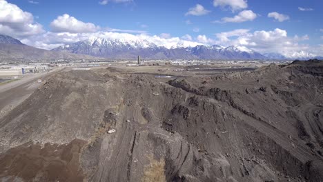 a drone captures footage of utah county flying over the dross of former geneva steal slag heap remains.