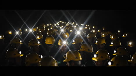 group of miners with headlamps