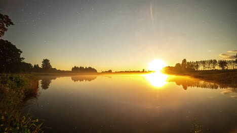 sky with the milky way and the sun rising next to a lake in which the horizon is reflected