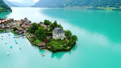 white island villa, iseltwald on blue lake brienz, switzerland, drone, summer