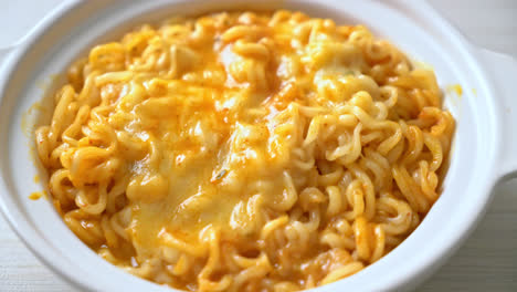 spicy instant noodle bowl with mozzarella cheese