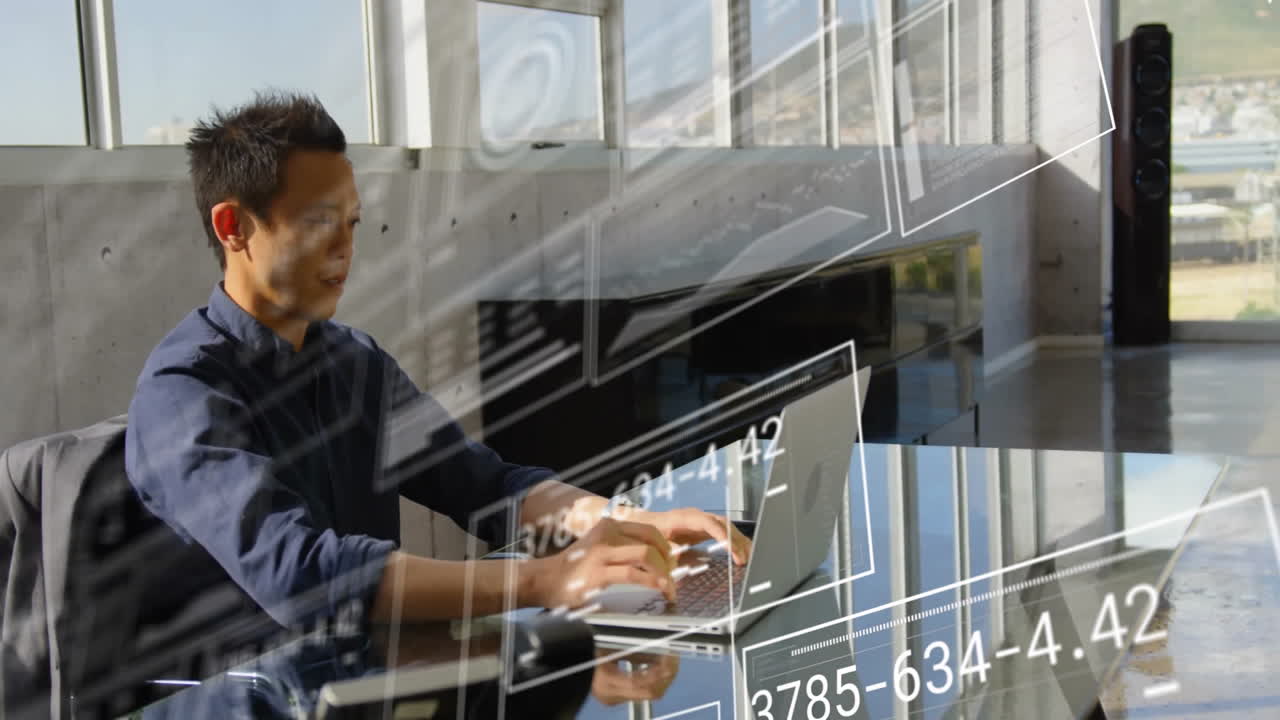 Animation of financial data processing over asian businessman using laptop in office