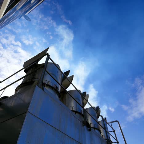 smoke from grain elevators. modern plant for drying seeds. white vapor released from industrial pipes of the granary.