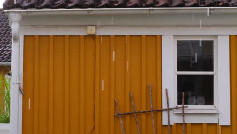 raining-a-bit-outside-yellow-house