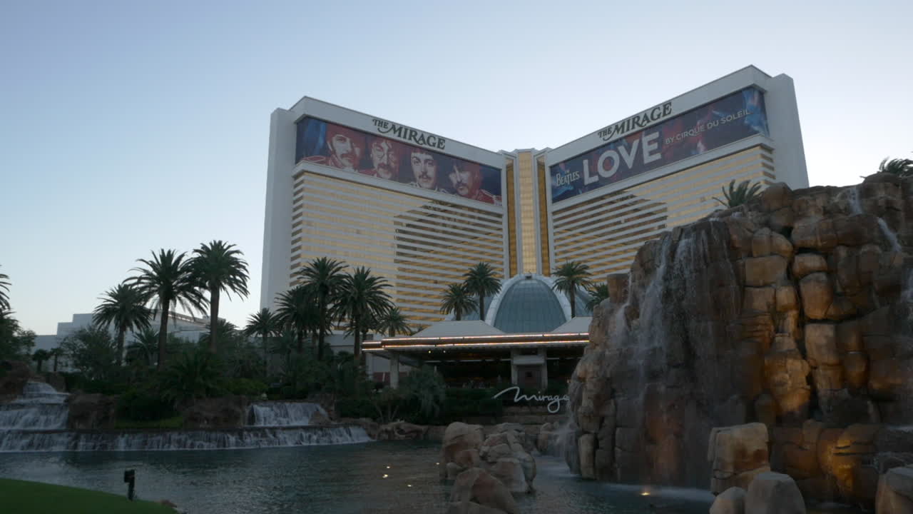 Slow pan of the tropical garden fountains in front of The Mirage Hotel and Casino, Las Vegas