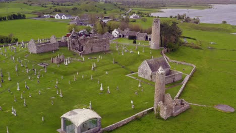 dynamic aerial descends towards clonmacnoise ancient ruins