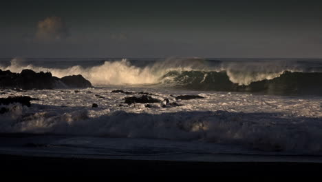 waves roll into a beach following a big storm 1