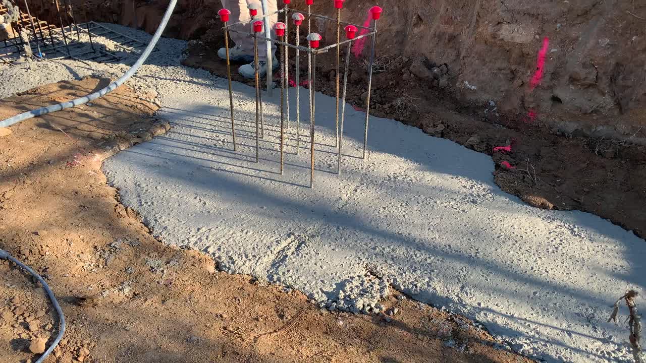 Construction Worker Pouring Concrete Foundation