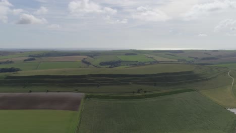 Aerial-tracking-forward-towards-Maiden-Castle-from-Dorchester