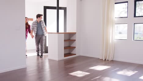excited family with baby exploring new home on moving day