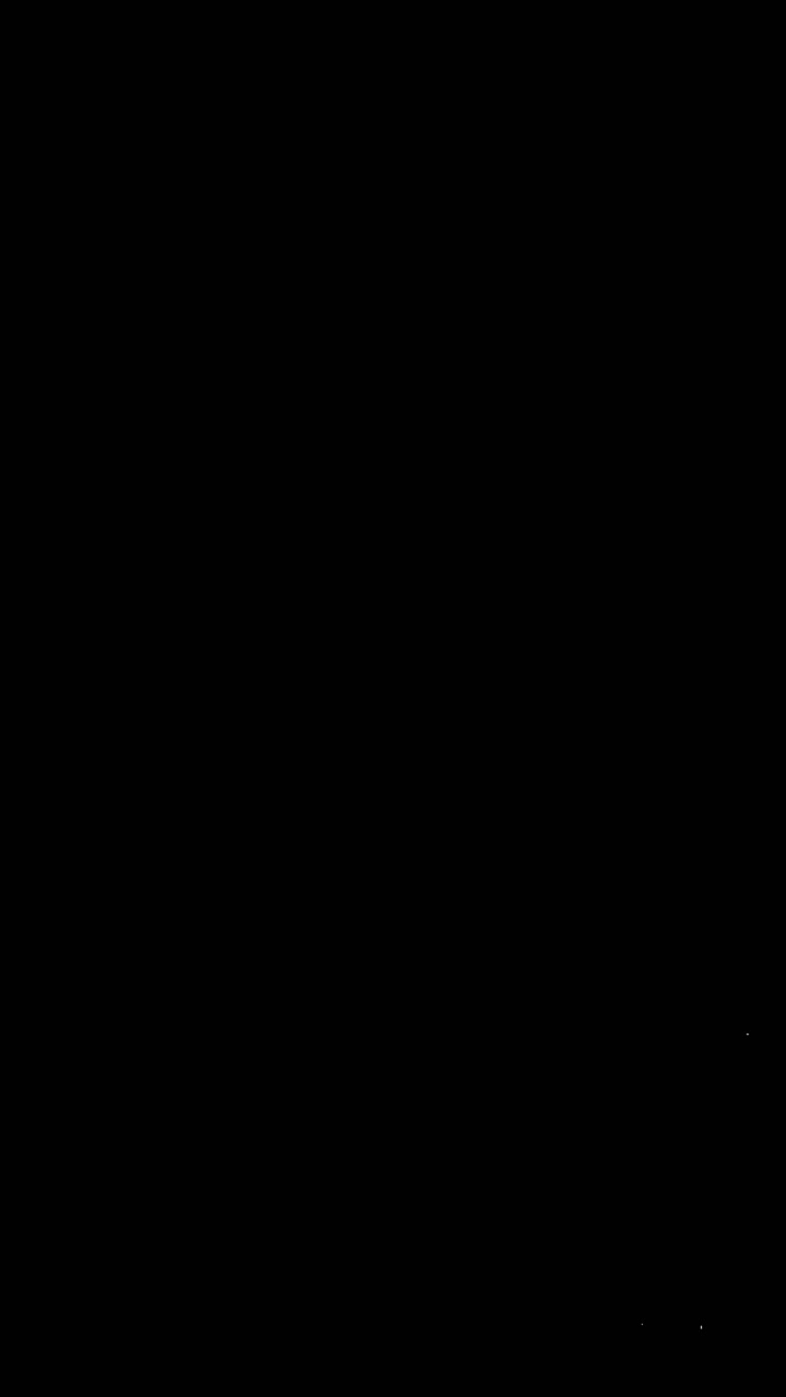 White Particles Falling and Floating on Black Background