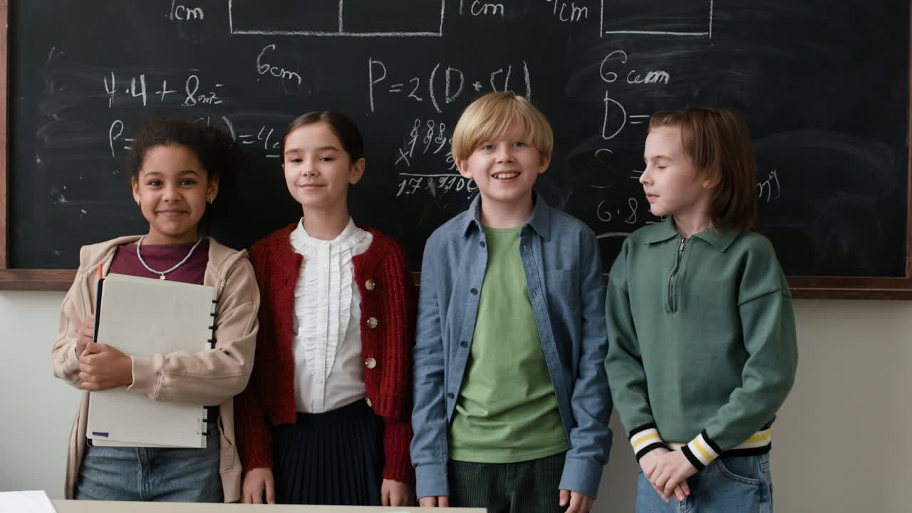 Children Posing in front of Chalkboard with Math Equations