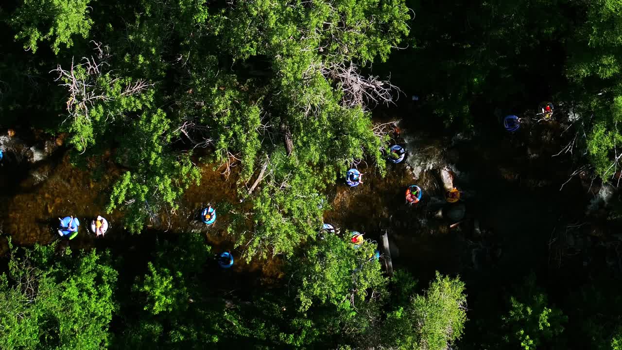 Boulder Creek early morning sunrise tube to work day Boulder Colorado aerial drone Birdseye view multiple tubing down the river Eldorado Canyon Golden South Platte Deckers sunny following right motion