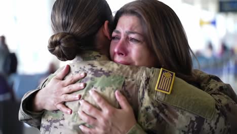 emotional reunion: a soldier and her loved one share a heartfelt embrace at the airport, capturing the deep bonds formed through love and sacrifice in military life