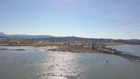 Aerial-view-over-slough-and-old-pylons