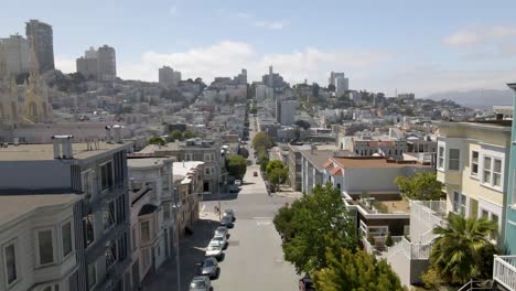 captivating drone footage rises above little italy in san francisco, ca, maintaining a one-point perspective with the road lines guiding the viewer deeper into this vibrant neighborhood's heart