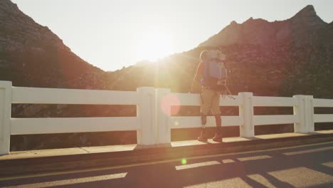 Sporty-mixed-race-man-with-prosthetic-leg-hiking