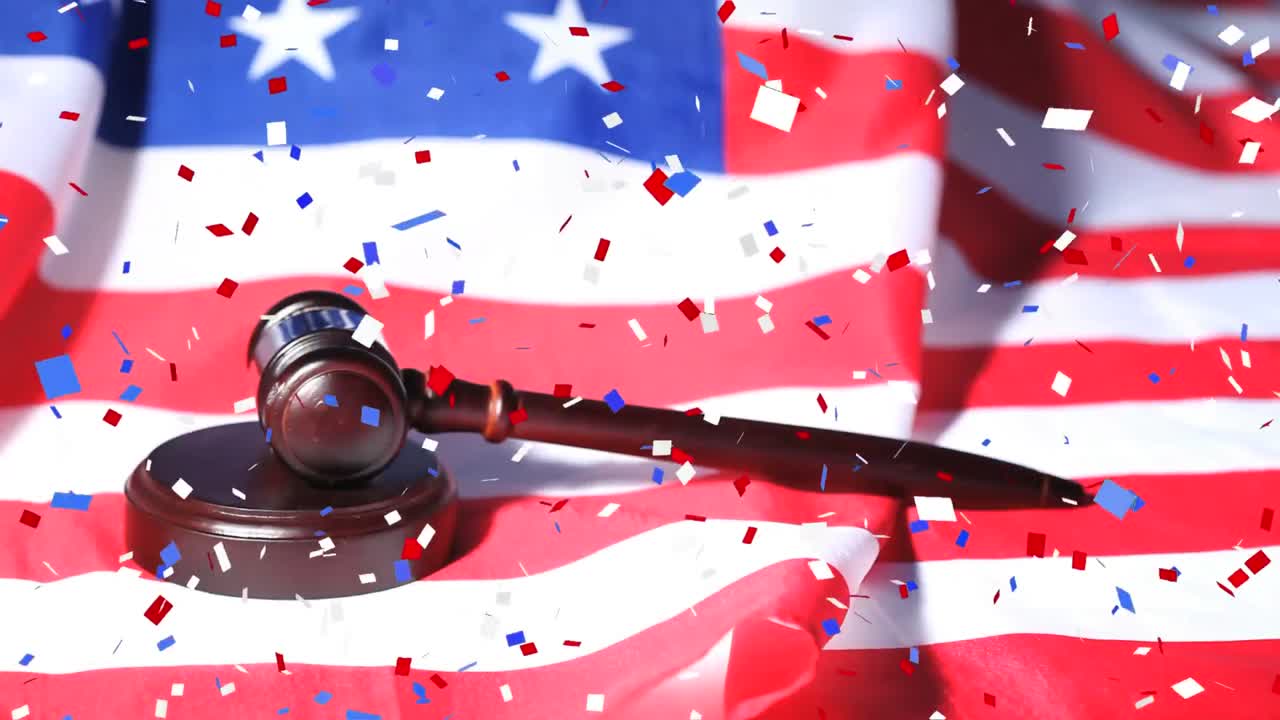 Colorful confetti falling over gavel against US flag