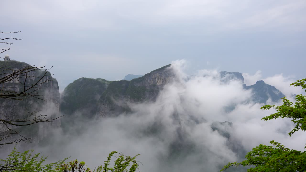 Fog enveloping the misty peaks of Tianmen Mountain in Zhangjiajie, China