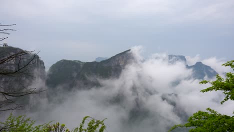 fog enveloping the misty peaks of tianmen mountain in zhangjiajie, china