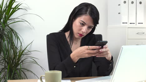 atractive female office worker angry typing at the desk