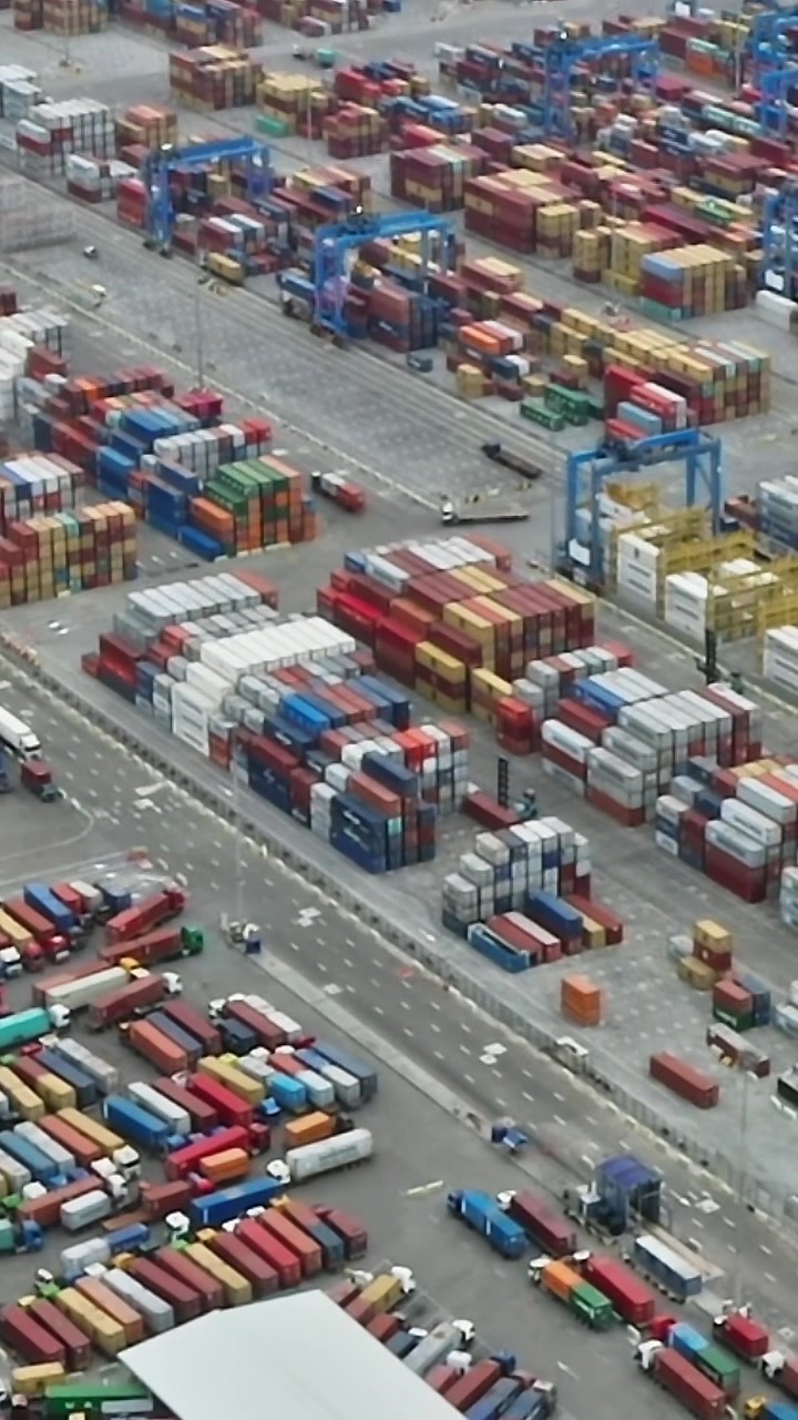 Cargo containers stacked in Accra port area during the day