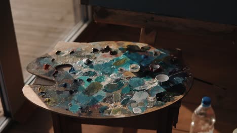 artist's wooden palette with paint stains