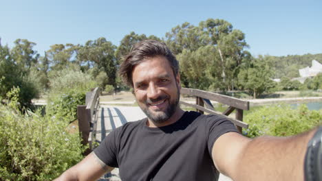 pov of smiling man taking selfie while having break from workout